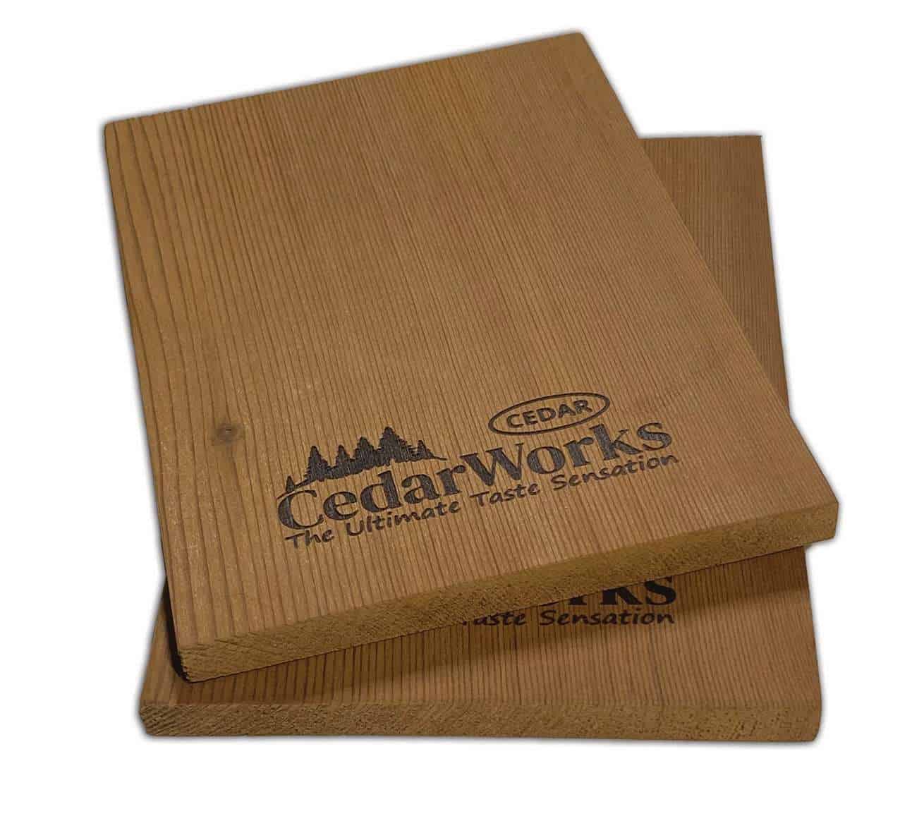 Sustainable cedar wood tasting boards with engraved Cedar Works logo, ideal for cheese and appetizer presentations. Perfect for enhancing dining experiences with natural wooden elegance.