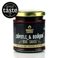 Chipotle & Bourbon BBQ Sauce jar with smoky branding and gold lid, perfect for grilling and culinary use.