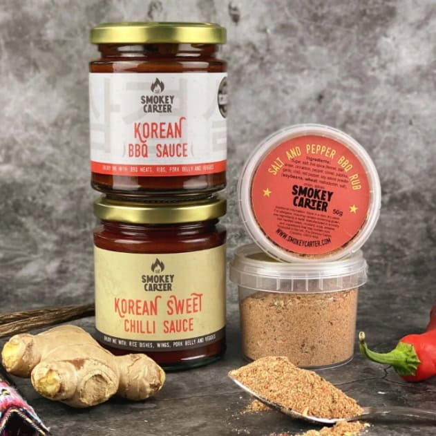 Korean BBQ sauces and seasonings from Smokey Carter, including spicy chili and sweet chili sauces, with fresh ginger and chili pepper for flavorful grilling.