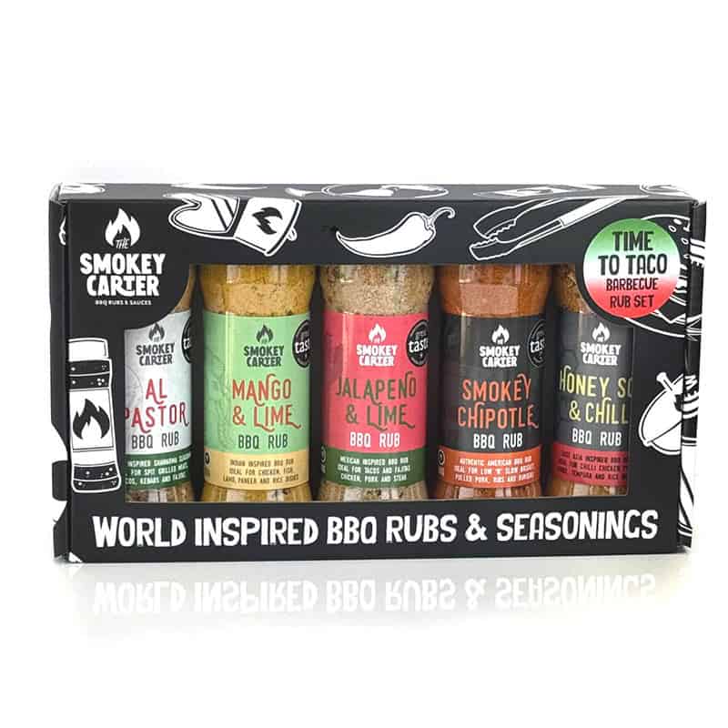 Smokey Carter BBQ rub set featuring world-inspired seasonings including Al Pastor, Mango & Lime, Jalapeño & Lime, Smokey Chipotle, and Honey Sizzle & Chill. Perfect for enhancing grilled meats and BBQ dishes.
