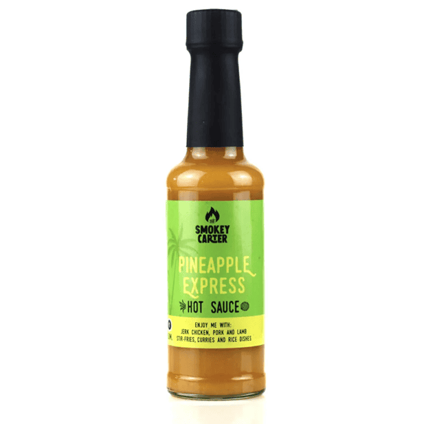 Pineapple Express hot sauce with smoky Carter branding, vibrant green label, and black cap, perfect for adding flavor to jerk chicken, pork, lamb, stir-fries, curries, and rice dishes.