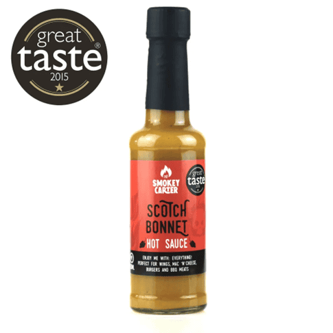 Smokey Carter Scotch Bonnet hot sauce with Great Taste award label, ideal for enhancing grilled meats, wings, and burgers, capturing bold Caribbean flavors.